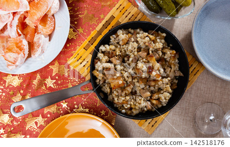 Pearl barley with fried pieces of lard Pearl barley with fried pieces of lard 142518176