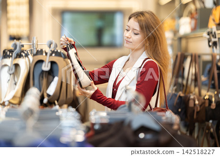 Young woman search and choose moccasin shoes Young woman search and choose moccasin shoes 142518227