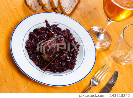 Stewed pork ribs served with cabbage Stewed pork ribs served with cabbage 142518243
