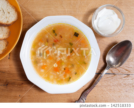 Rassolnik with sour pickles and pearl barley Rassolnik with sour pickles and pearl barley 142518333
