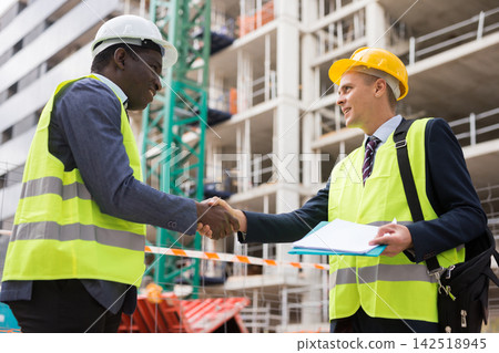 Engineers shaking hands on construction site Engineers shaking hands on construction site 142518945