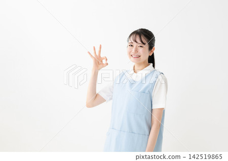 A woman in an apron A woman in an apron 142519865