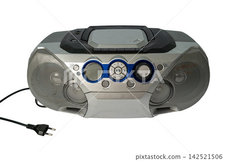 Old portable music player on a white background with power cable Old portable music player on a white background with power cable 142521506
