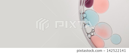 Abstract science background with colorful liquid mixing, forming bubbles and droplets Abstract science background with colorful liquid mixing, forming bubbles and droplets 142522141