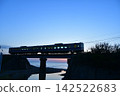 train running at dusk 142522683