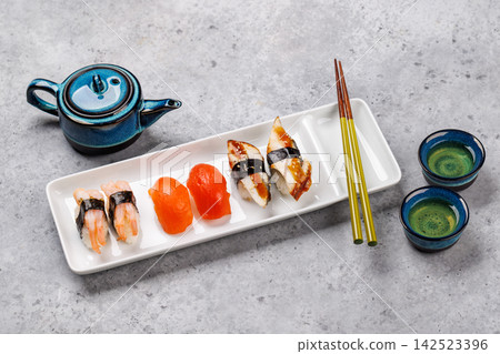 Sushi set with tea and small teapot Sushi set with tea and small teapot 142523396