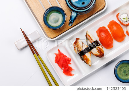 Sushi set with tea and small teapot Sushi set with tea and small teapot 142523403
