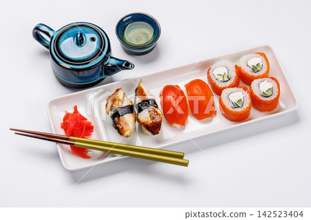 Sushi set with tea and small teapot Sushi set with tea and small teapot 142523404