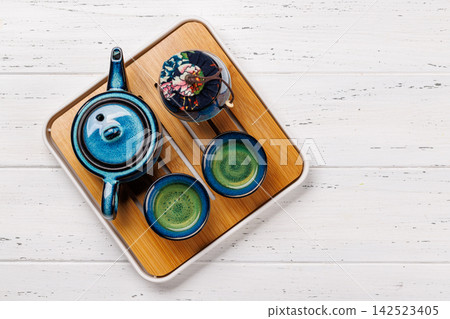 Asian tea ceremony set with teapot and cups Asian tea ceremony set with teapot and cups 142523405
