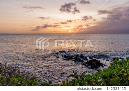 Calm ocean at sunset in Hawaii Calm ocean at sunset in Hawaii 142523425