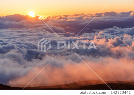 Sunset above clouds from volcano in Hawaii Sunset above clouds from volcano in Hawaii 142523441