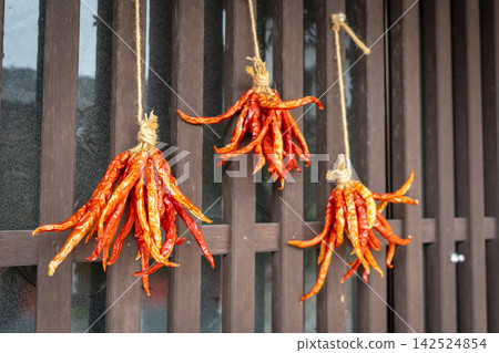 Drying chili peppers in Magome village on the Nakasendo trail Drying chili peppers in Magome village on the Nakasendo trail 142524854