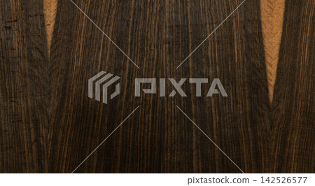 Ebony wood background featuring dark grain texture Ebony wood background featuring dark grain texture 142526577