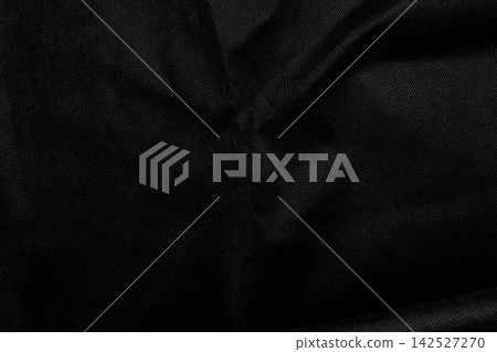 Abstract background of dark black crumpled fabric texture with elegant folds and fine woven textile pattern Abstract background of dark black crumpled fabric texture with elegant folds and fine woven textile pattern 142527270