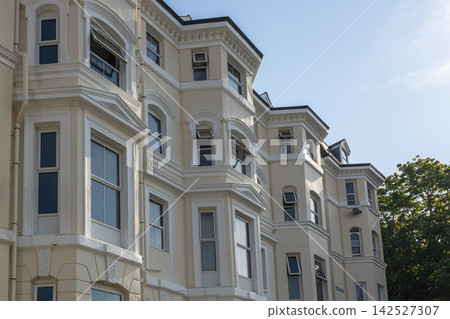Traditional british residential townhouses facade Traditional british residential townhouses facade 142527307