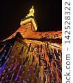 A fantastical scene capturing the illuminated Tokyo Tower and the colorful carp streamers adorning the night sky. 142528322