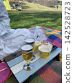Drinking beer at a picnic 142528723