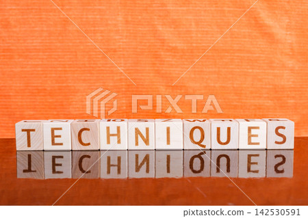 motivational word Techniques is laid out from letters on wooden cubes motivational word Techniques is laid out from letters on wooden cubes 142530591