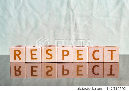 motivational word Respect is laid out from letters on wooden cubes motivational word Respect is laid out from letters on wooden cubes 142530592
