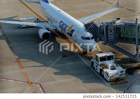 Airplanes waiting on the tarmac Airplanes waiting on the tarmac 142531725