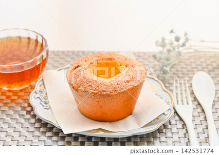 Enjoy a café time at home with chiffon cake and tea. Enjoy a café time at home with chiffon cake and tea. 142531774