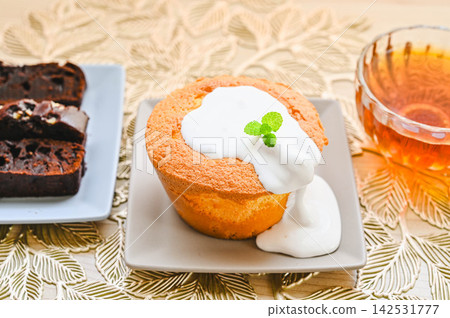 Freshly baked chiffon cake with whipped cream. Freshly baked chiffon cake with whipped cream. 142531777