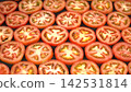 Full frame background of fresh ripe tomato slices laid out in seamless pattern, healthy organic food abstract texture 142531814