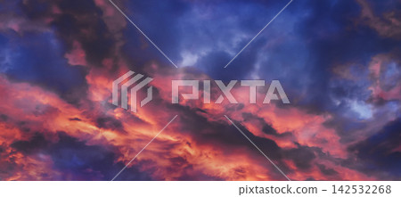 Dramatic cloudy sky painted with vibrant orange and purple colors at dusk Dramatic cloudy sky painted with vibrant orange and purple colors at dusk 142532268