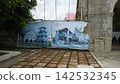 A historic church on Bohol Island in the Philippines and a restoration site showing earthquake damage. 142532345