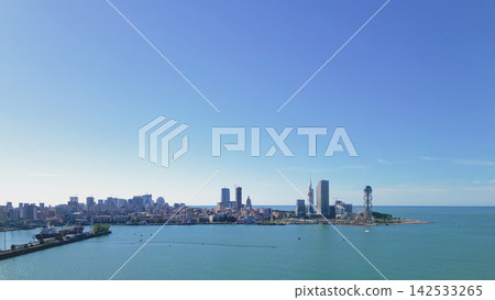 Panoramic view of Batumi city skyline with modern architecture, coastline, and clear blue sky, showcasing the Black Sea and urban landscape of Georgia Panoramic view of Batumi city skyline with modern architecture, coastline, and clear blue sky, showcasing the Black Sea and urban landscape of Georgia 142533265