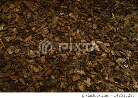 Bark mulch texture with brown wood chips for landscaping Bark mulch texture with brown wood chips for landscaping 142533285