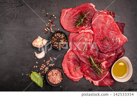Raw organic steak with ingredients for cooking 142533354