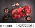 Raw organic steak with ingredients for cooking 142533361