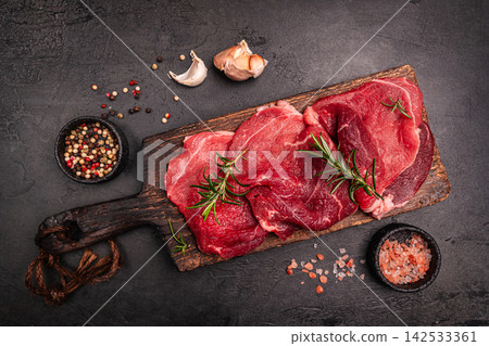 Raw organic steak with ingredients for cooking 142533361