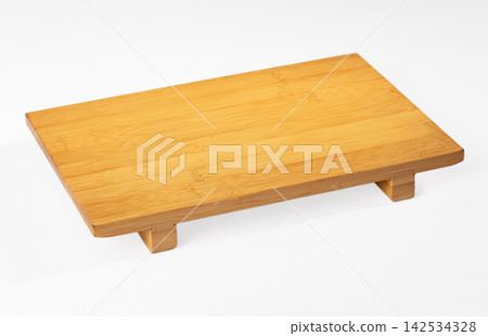 Rectangular bamboo tray with raised feet on white background Rectangular bamboo tray with raised feet on white background 142534328