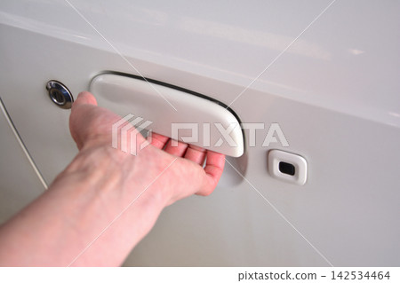 The hand that opens the car door The hand that opens the car door 142534464