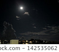 moon floating in the night sky 142535062