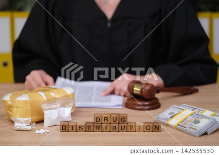 Court proceedings on drug distribution with evidence laid out in front of the judge Court proceedings on drug distribution with evidence laid out in front of the judge 142535530