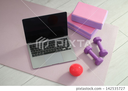 Home training area features collection of fitness accessories Home training area features collection of fitness accessories 142535727