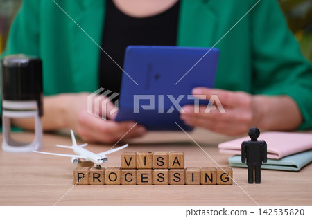 Visa processing at a bustling travel office during business hours Visa processing at a bustling travel office during business hours 142535820