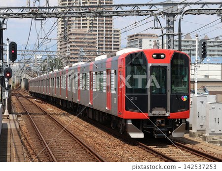A Hanshin Railway 1000 series train running near Daimotsu Station. A Hanshin Railway 1000 series train running near Daimotsu Station. 142537253