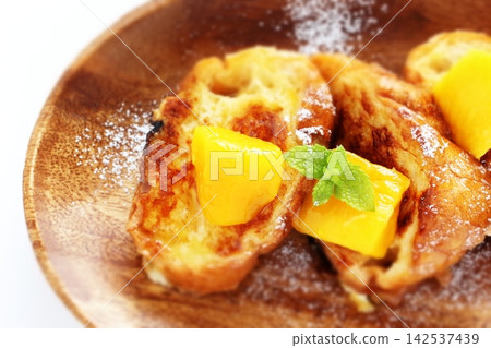 French toast topped with mango French toast topped with mango 142537439