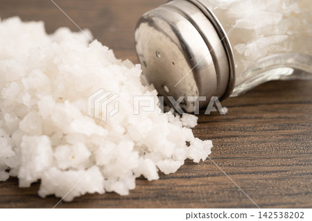 Sodium chloride sea salt with salt shaker. 142538202
