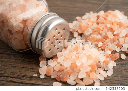 Sodium chloride Himalayan pink salt with salt shaker. Sodium chloride Himalayan pink salt with salt shaker. 142538203