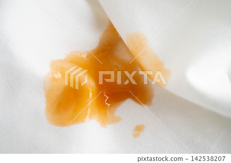 Dirty tomato sauce stain removal or ketchup on cloth accident to wash with washing powder, cleaning housework. Dirty tomato sauce stain removal or ketchup on cloth accident to wash with washing powder, cleaning housework. 142538207