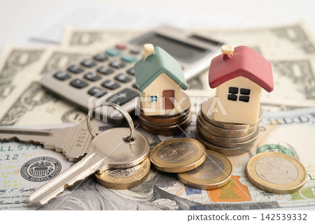 House on stack coins, mortgage home loan insurance finance. House on stack coins, mortgage home loan insurance finance. 142539332