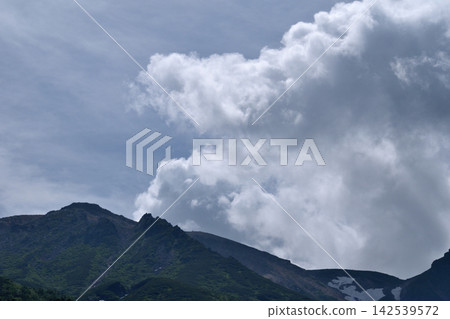 Clouds climbing up the mountain Clouds climbing up the mountain 142539572