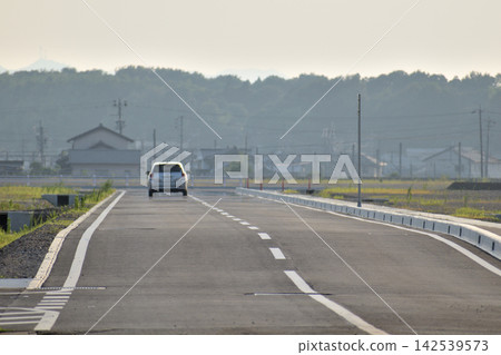 Industrial park under construction, roads with little foot traffic Industrial park under construction, roads with little foot traffic 142539573