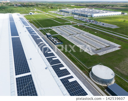 Aerial view of a modern logistics center with solar panels on the roof Aerial view of a modern logistics center with solar panels on the roof 142539607