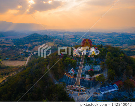Landscape of Wat Pa Phu Hai Long temple on the mountain at sunset time at Pak Chong, Nakhon Ratchasima, Thailand. Landscape of Wat Pa Phu Hai Long temple on the mountain at sunset time at Pak Chong, Nakhon Ratchasima, Thailand. 142540043